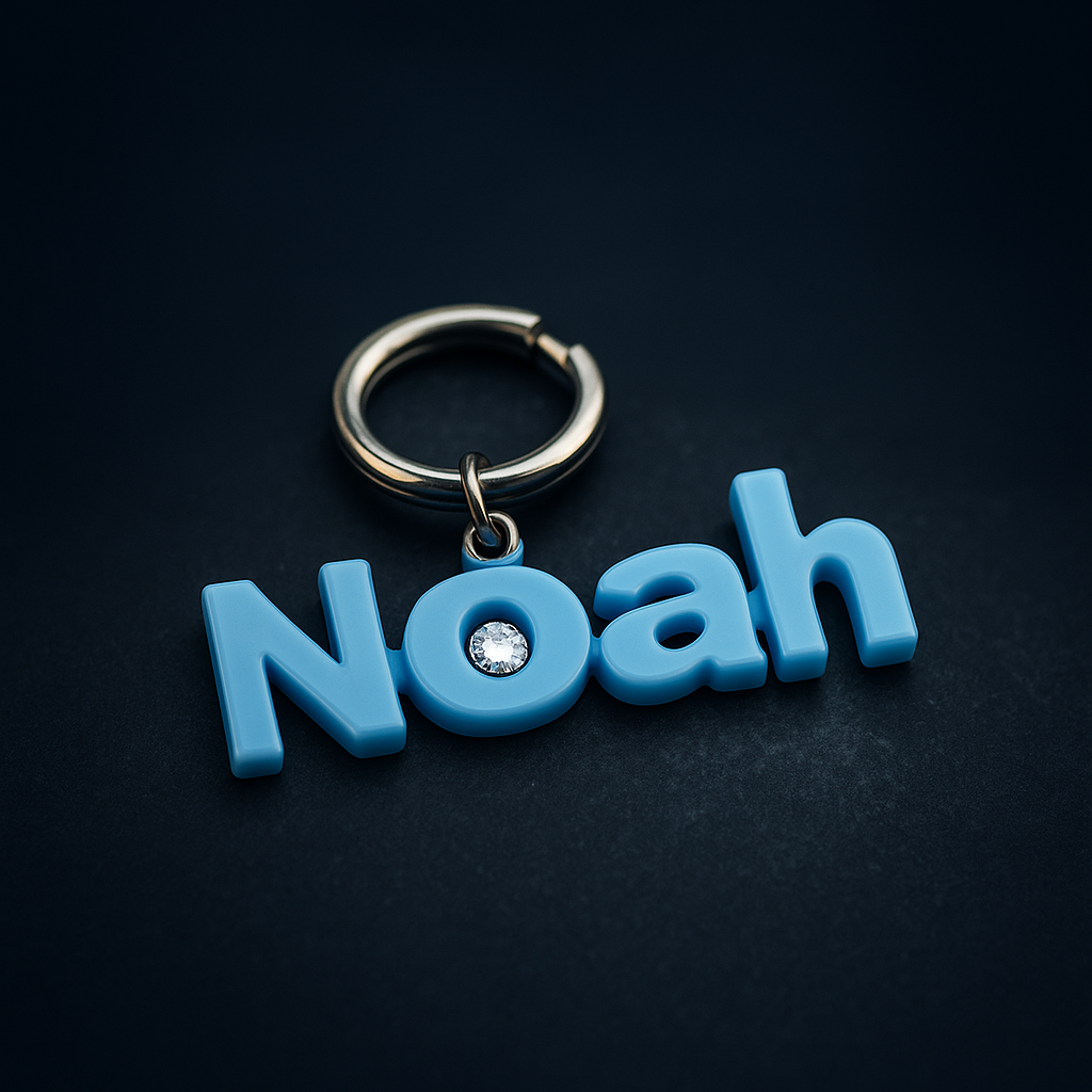 Blue keychain with 'Noah' on a black background